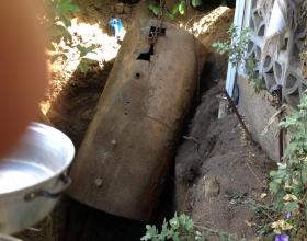 A leaking buried oil tank being removed in Victoria BC