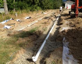 Installing septic field pipes in Duncan BC