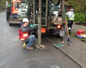 Drilling in the road for soil testing in Victoria BC