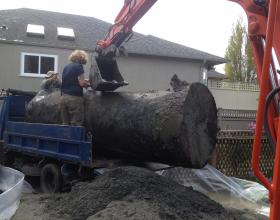 Loading a large oil tank onto a truck in Duncan BC