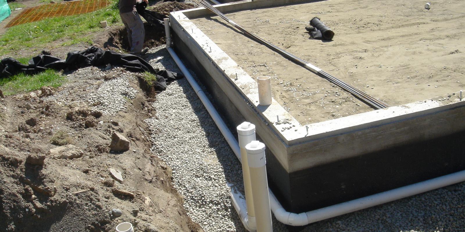 Concrete house foundation and drainage