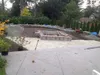 Thumbnail: Backyard landscape with retaining walls and hot tub