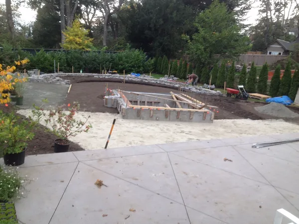Backyard landscape with retaining walls and hot tub