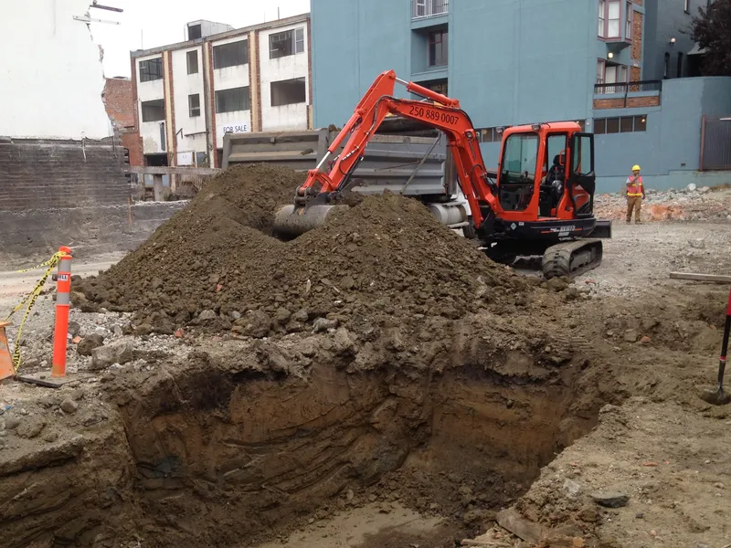 Excavation equipment digging basement foundation