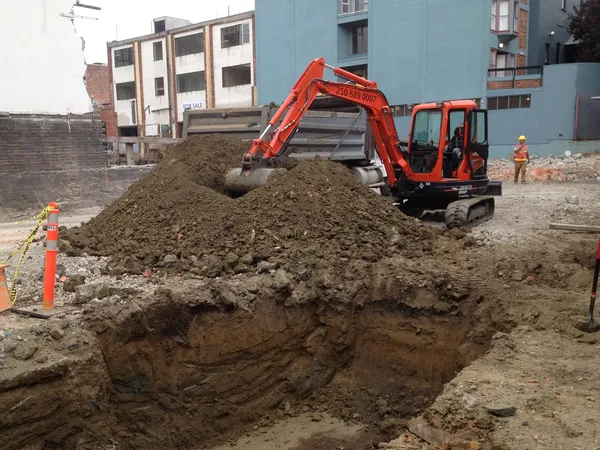 Excavation equipment digging basement foundation