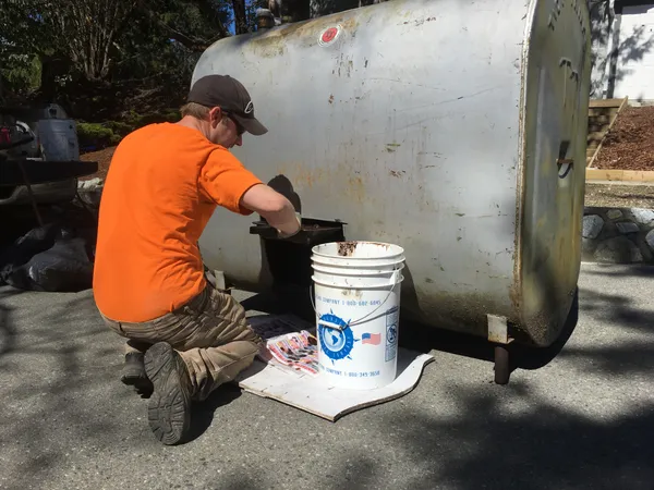 Cleaning out an above ground oil tank from inside basement