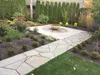 Thumbnail: Finished concrete patio with slate sidewalk inset