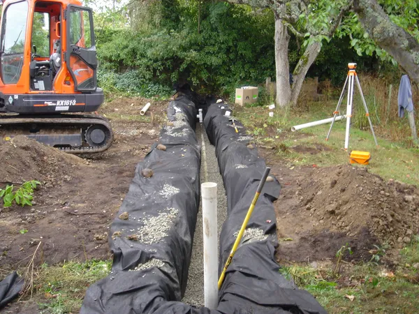 Curtain drain and interceptor drain installation