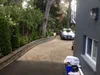 Thumbnail: Completed driveway with retaining wall and plantings