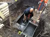 Thumbnail: Excavator removing buried oil tank