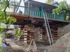 Thumbnail: Building being raised for foundation work