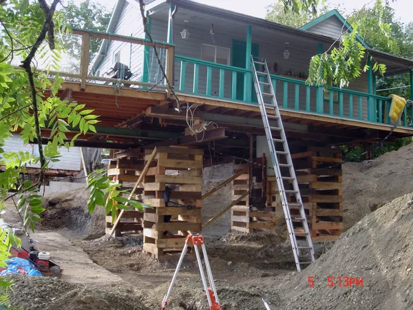 Building being raised for foundation work