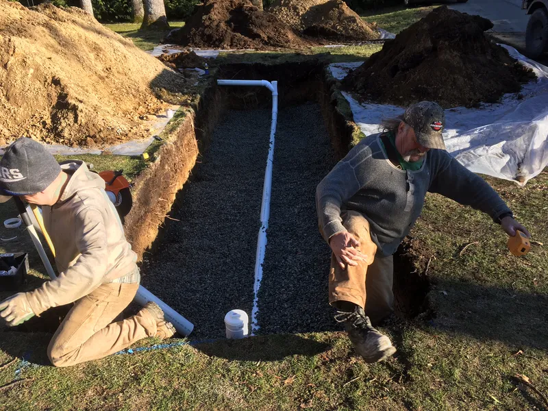 Constructing an infiltrator ditch for household perimeter and rainwater leader drainage