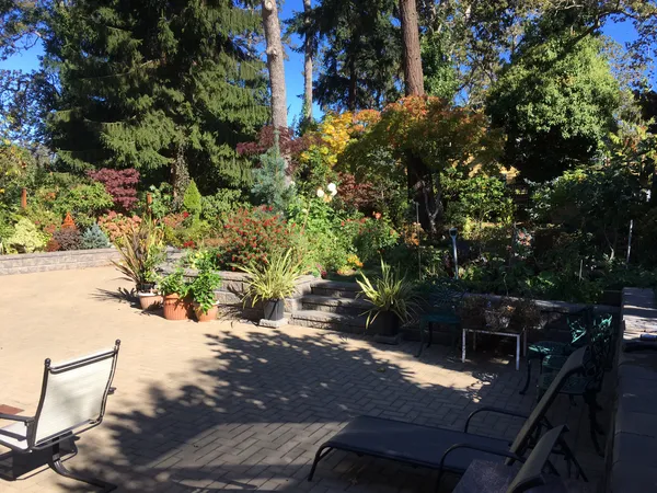Finished landscape with driveway and retaining walls