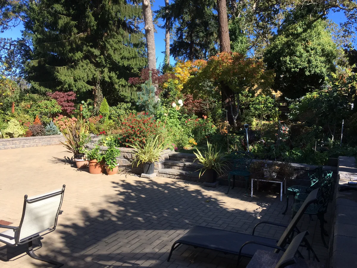 Finished landscape with driveway and retaining walls