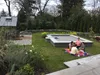 Thumbnail: Completed landscape with lawn and greenhouse