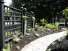 Thumbnail: Lattice fence with flagstone sidewalk