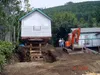 Thumbnail: Raised building awaiting new foundation