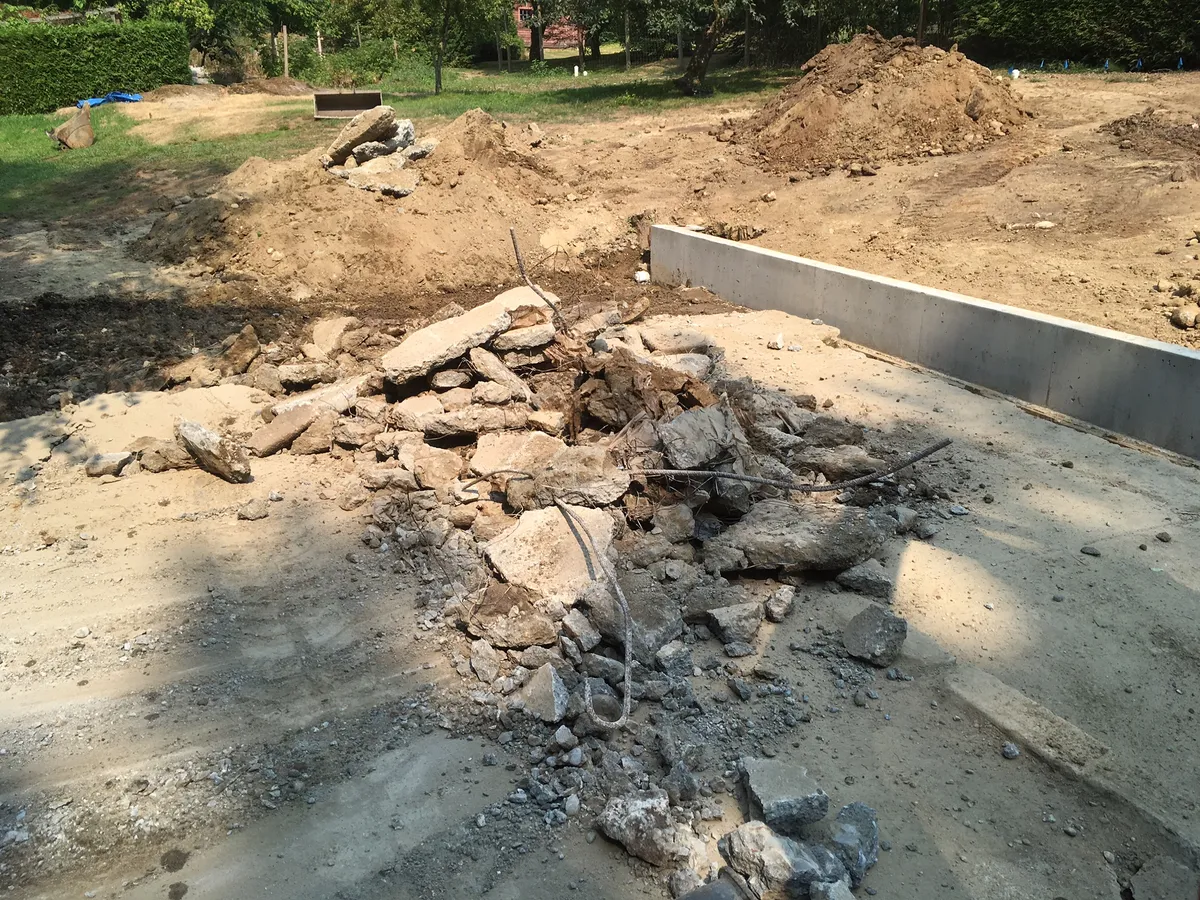 Breaking steel-reinforced concrete driveway