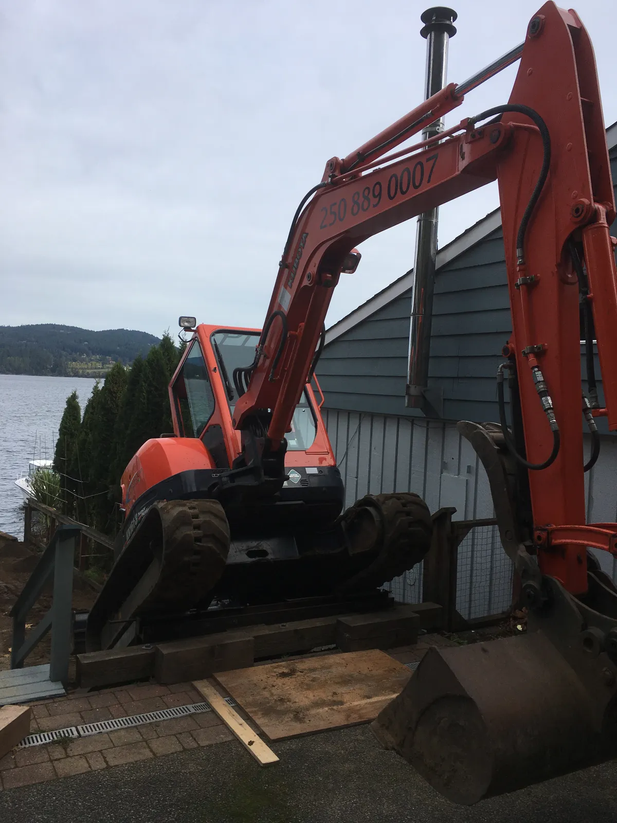 Excavator accessing tight residential spaces