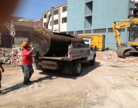 The commercial oil tank being removed from site in Duncan BC