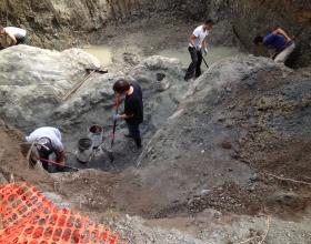 Chipping contaminated soil off rocks in Victoria BC