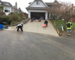 Concrete finishers building new Concrete Driveway