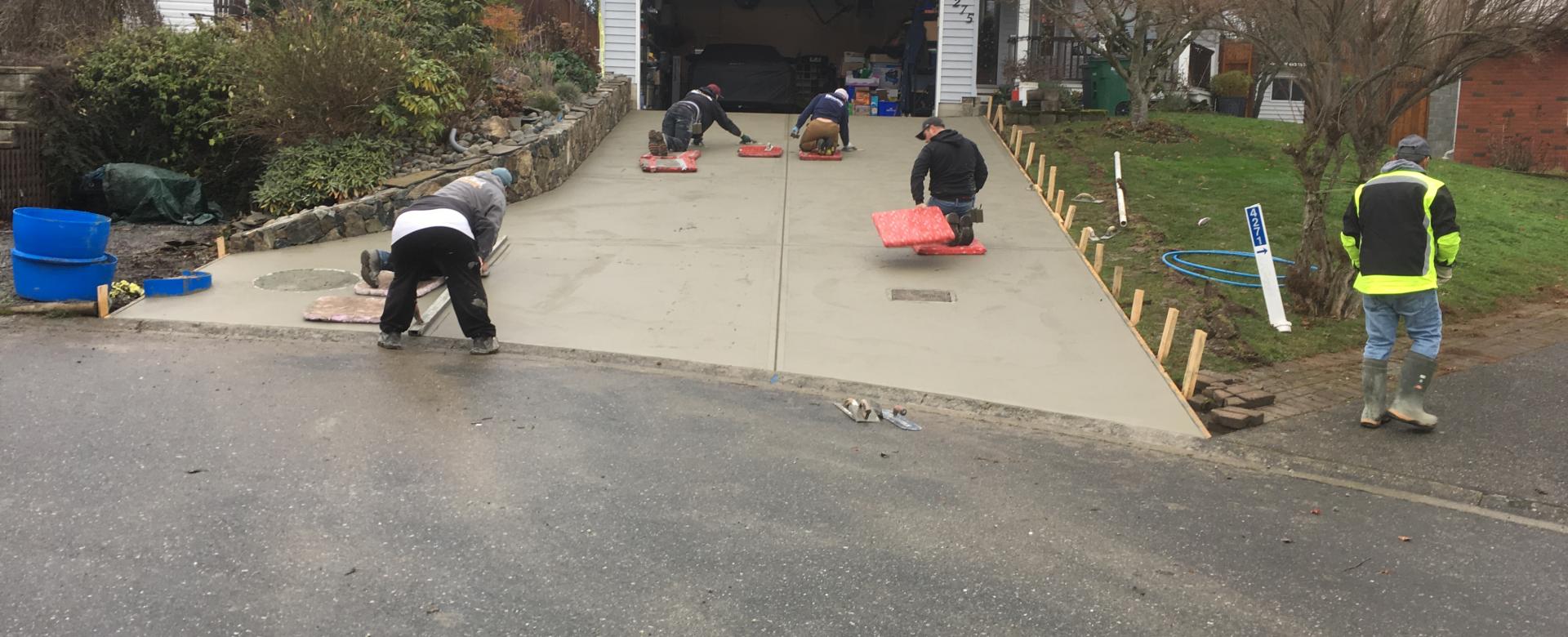 Concrete finishers building new Concrete Driveway